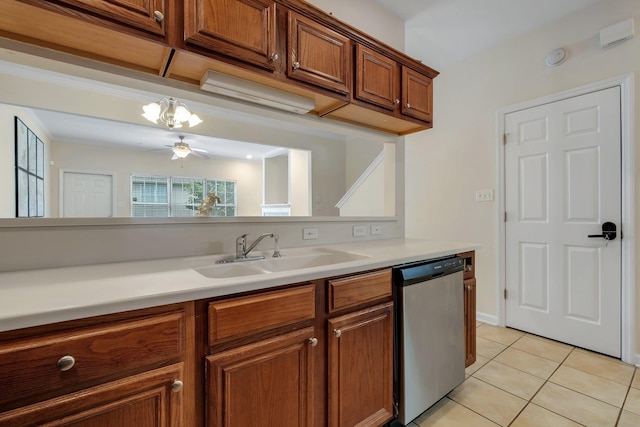 1320 Hendrix Rd Unit 403, Tallahassee, FL 32301 - kitchen with stainless steel dishwasher, brown cabinetry, light tile patterned floors, light countertops, and a chandelier