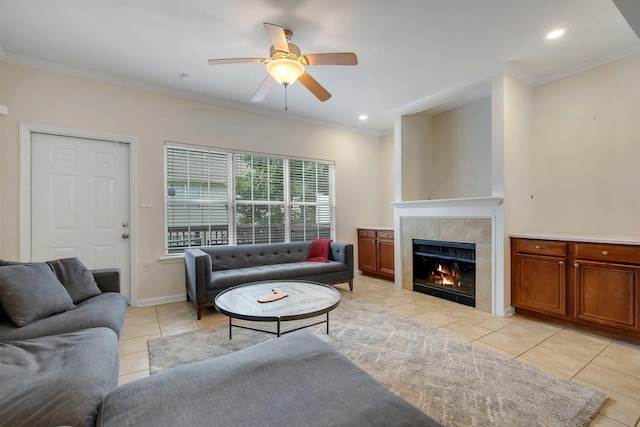 1320 Hendrix Rd Unit 403, Tallahassee, FL 32301 - living area with light tile patterned floors, crown molding, ceiling fan, a tile fireplace, and recessed lighting