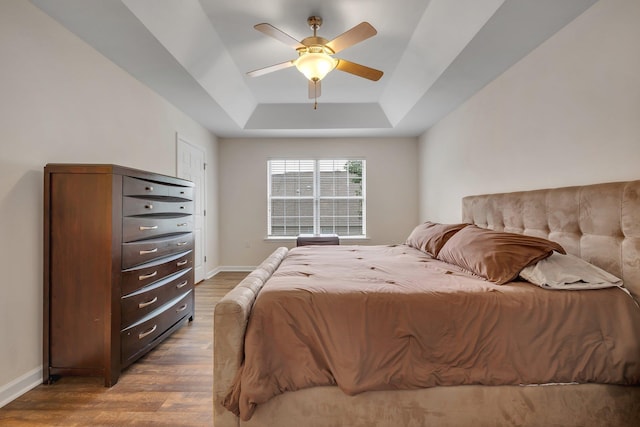 1320 Hendrix Rd Unit 403, Tallahassee, FL 32301 - bedroom with wood finished floors, a raised ceiling, and ceiling fan