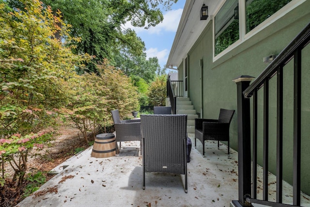 view of patio featuring outdoor dining area