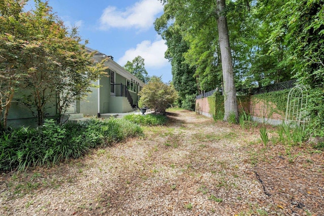view of yard featuring fence
