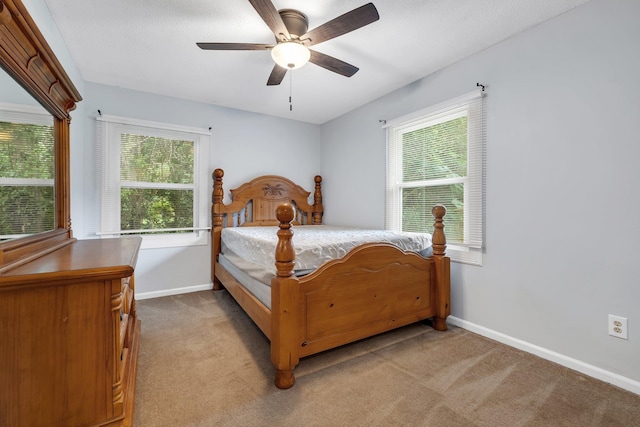 2121 Shadyoaks Dr, Tallahassee, FL 32303 - carpeted bedroom featuring multiple windows and a ceiling fan