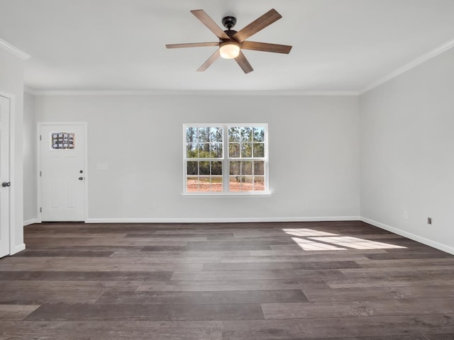 empty room with ornamental molding, ceiling fan, and dark wood-type flooring