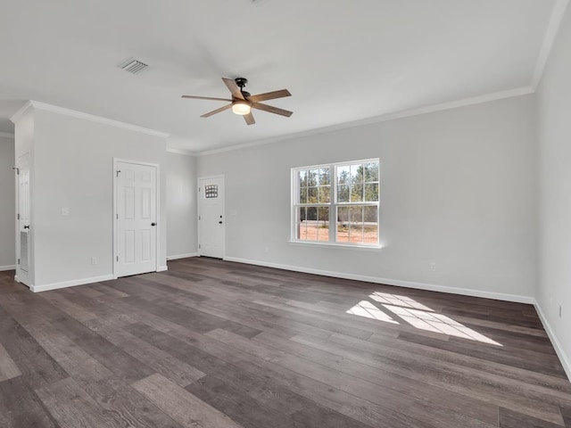 empty room featuring crown molding, ceiling fan, and dark wood-type flooring