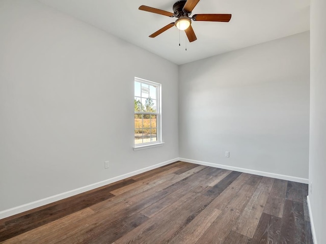 spare room featuring dark hardwood / wood-style floors and ceiling fan