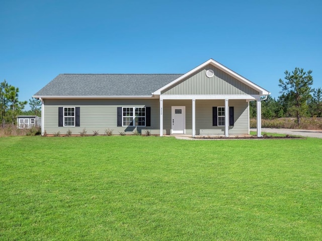 view of front of home featuring a porch and a front lawn