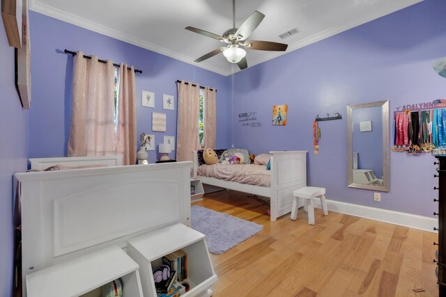 1165 Dills Rd, Monticello, FL 32344 - bedroom with crown molding, light wood-style floors, baseboards, and a ceiling fan