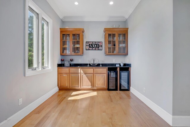 1165 Dills Rd, Monticello, FL 32344 - indoor wet bar featuring healthy amount of natural light, light wood-type flooring, beverage cooler, baseboards, and recessed lighting
