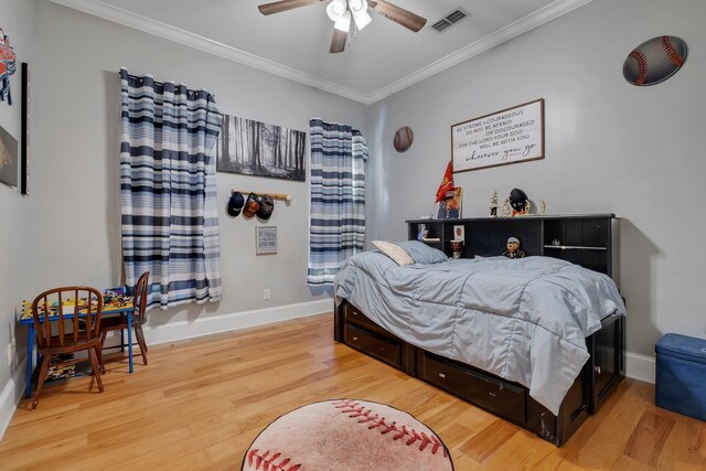 1165 Dills Rd, Monticello, FL 32344 - bedroom featuring ornamental molding, wood finished floors, baseboards, and a ceiling fan