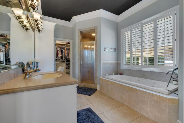 1165 Dills Rd, Monticello, FL 32344 - full bath with a shower stall, a walk in closet, ornamental molding, a bath, and tile patterned flooring