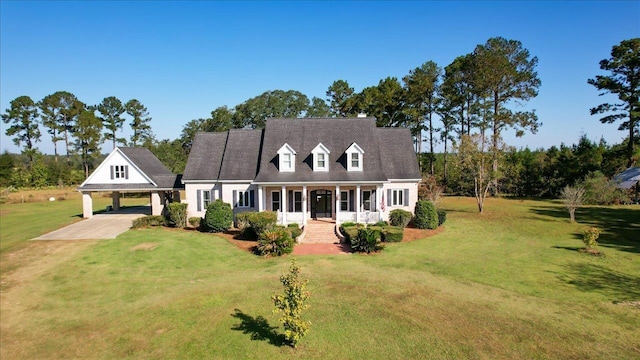 1165 Dills Rd, Monticello, FL 32344 - cape cod home featuring covered porch, a front lawn, an attached carport, and driveway