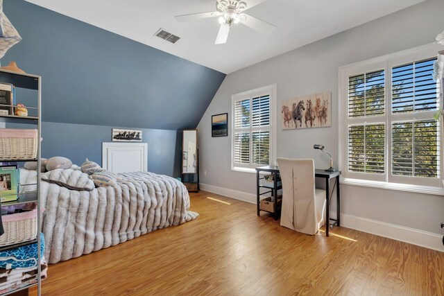 1165 Dills Rd, Monticello, FL 32344 - bedroom featuring wood finished floors, multiple windows, vaulted ceiling, baseboards, and ceiling fan