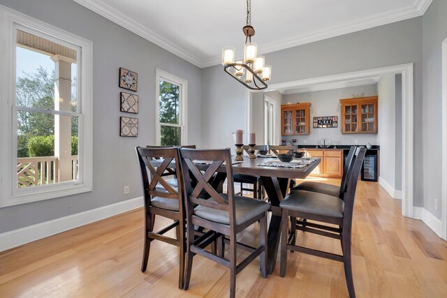 1165 Dills Rd, Monticello, FL 32344 - dining area with light wood-type flooring, a chandelier, ornamental molding, and baseboards