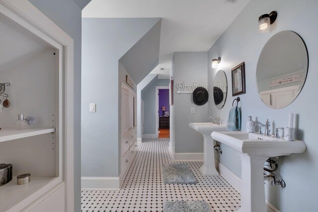 1165 Dills Rd, Monticello, FL 32344 - bathroom featuring baseboards and two sinks