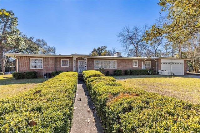 single story home featuring a front lawn, brick siding, a garage, and a chimney