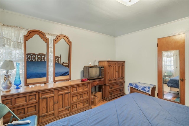 bedroom with crown molding