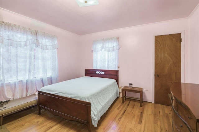 bedroom with wood finished floors