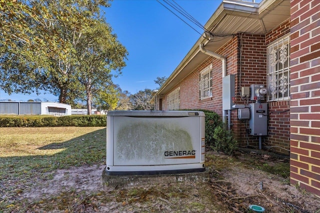 exterior space featuring brick siding, a power unit, and electric meter