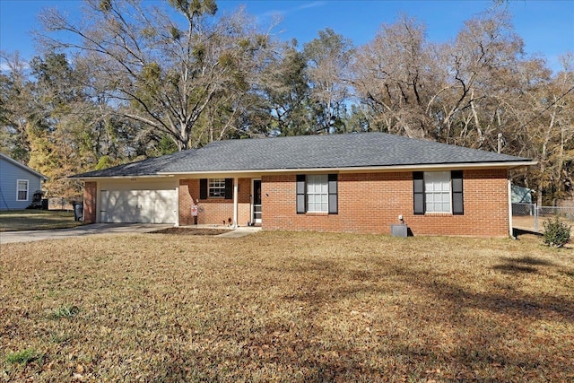 single story home featuring a garage and a front yard