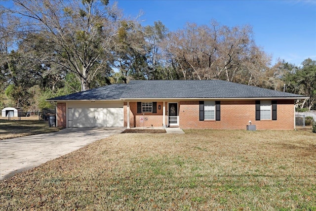 ranch-style home with a garage and a front lawn