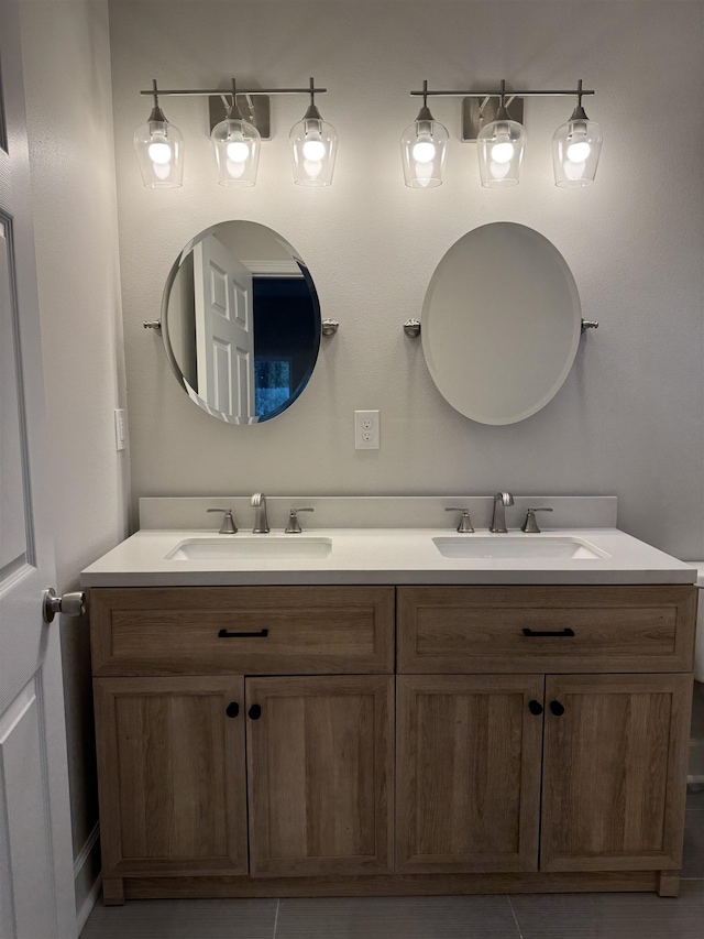 bathroom with double vanity and a sink