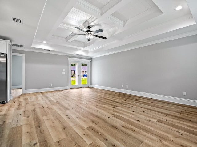 unfurnished room featuring french doors, light wood-type flooring, ornamental molding, and coffered ceiling