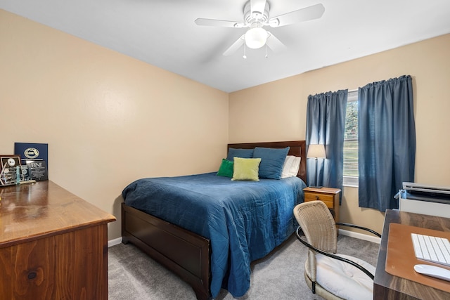 bedroom featuring baseboards, a ceiling fan, and carpet flooring