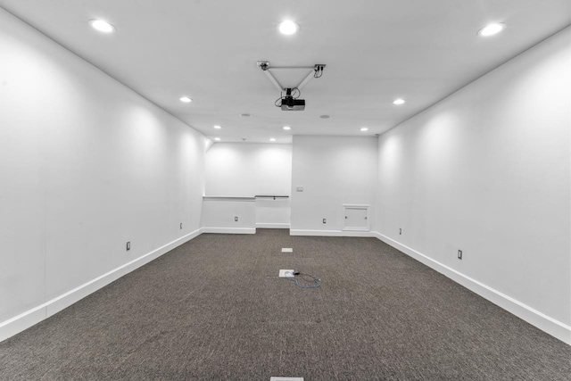 empty room featuring dark carpet