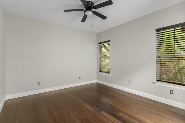 unfurnished room featuring dark hardwood / wood-style floors and ceiling fan