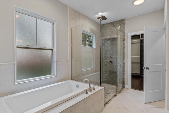 bathroom featuring tile patterned floors and plus walk in shower