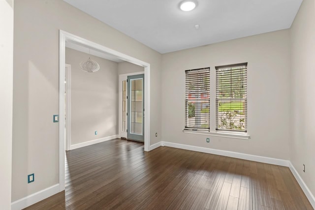 unfurnished room featuring dark hardwood / wood-style floors