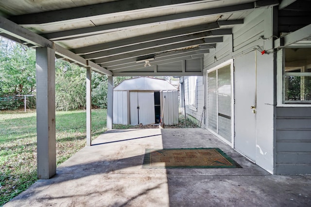 view of patio featuring a storage unit