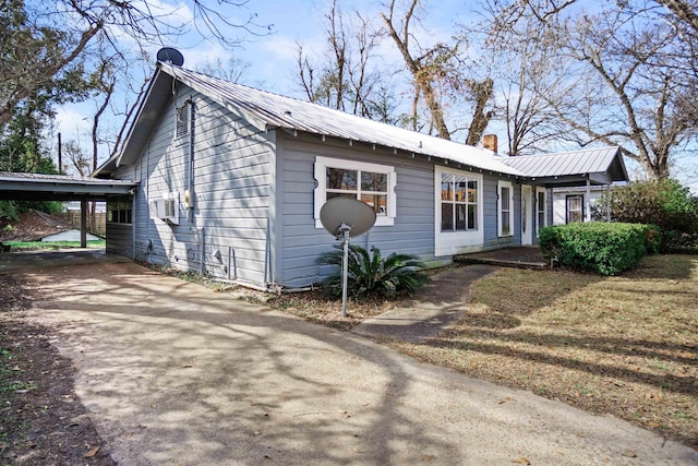 exterior space with a carport