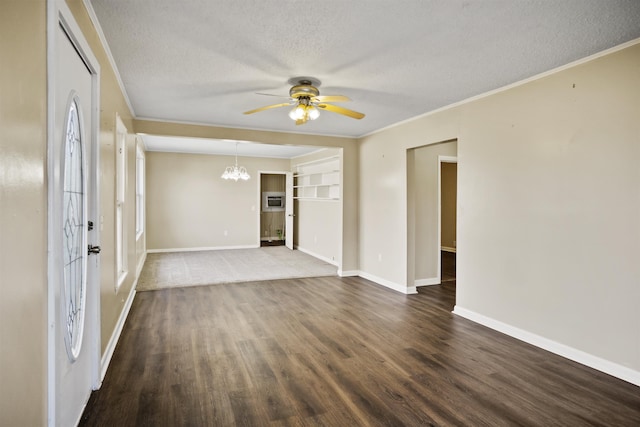 empty room with dark hardwood / wood-style flooring, crown molding, ceiling fan with notable chandelier, and a textured ceiling