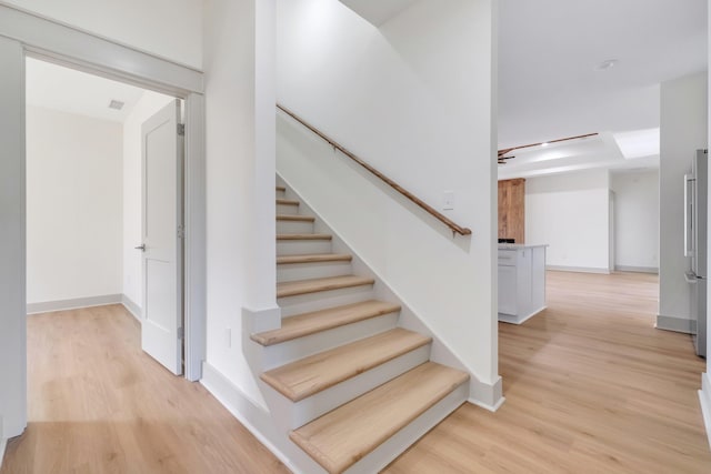 staircase featuring hardwood / wood-style flooring