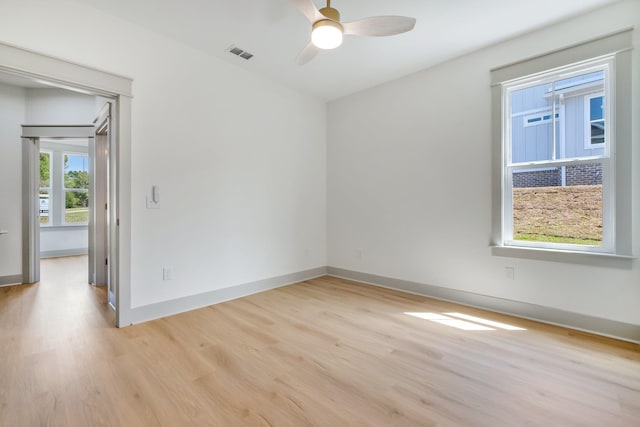 spare room with ceiling fan and light hardwood / wood-style flooring