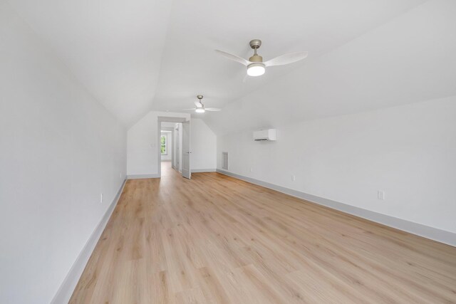 additional living space with ceiling fan, light hardwood / wood-style floors, and lofted ceiling