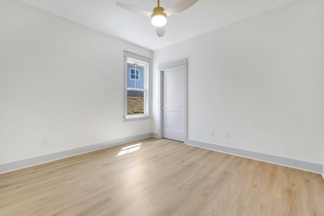 empty room with light hardwood / wood-style floors and ceiling fan