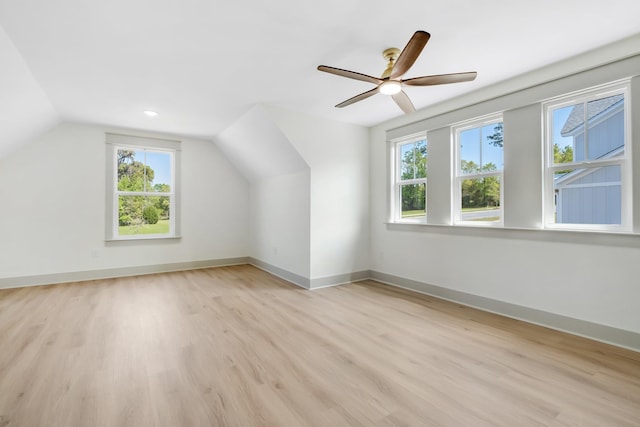 additional living space with light hardwood / wood-style flooring, ceiling fan, and lofted ceiling