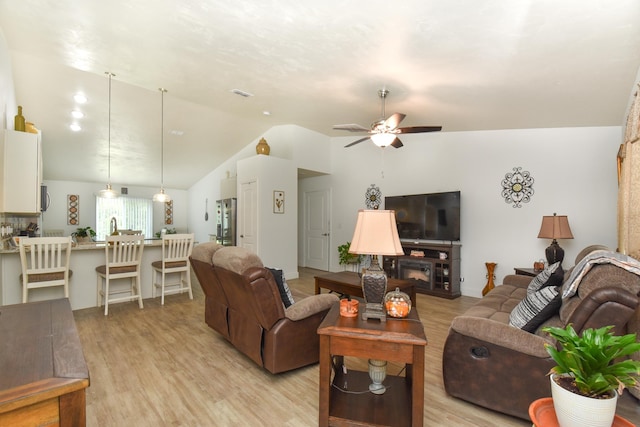 359 Mae Cato Dr, Midway, FL 32343 - living room featuring lofted ceiling, ceiling fan, and light wood finished floors