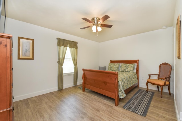 359 Mae Cato Dr, Midway, FL 32343 - bedroom with light wood-style floors, baseboards, and ceiling fan