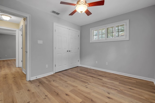 4653 Soaring Way, Tallahassee, FL 32311 - unfurnished bedroom with baseboards, light wood-style flooring, and a closet