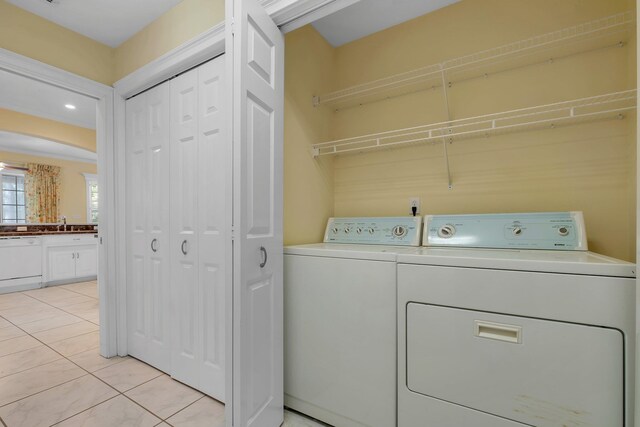 4653 Soaring Way, Tallahassee, FL 32311 - laundry room with washing machine and dryer and light tile patterned flooring