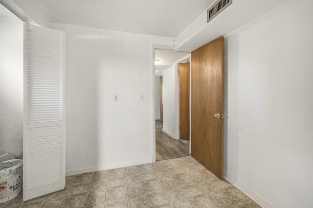 corridor with visible vents and baseboards