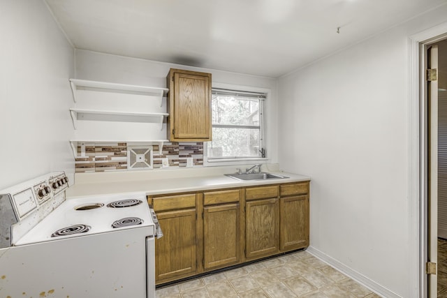 kitchen with white electric stove, brown cabinets, a sink, open shelves, and backsplash