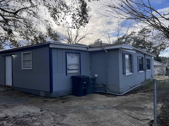 view of side of property featuring a patio