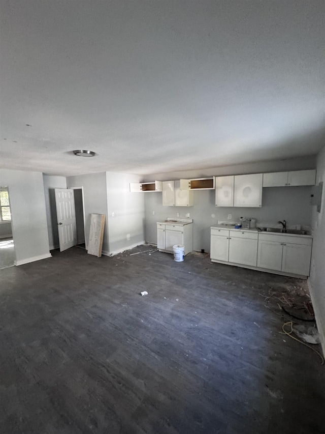 unfurnished living room with sink