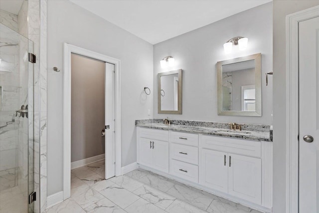 bathroom with a shower with door and vanity