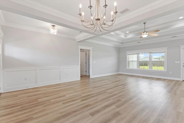 spare room with ceiling fan with notable chandelier, light hardwood / wood-style floors, and crown molding