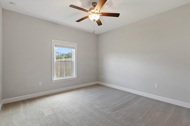 empty room featuring carpet flooring and ceiling fan